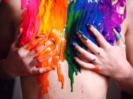 hands holding boobs on national coming out day with coming out quotes